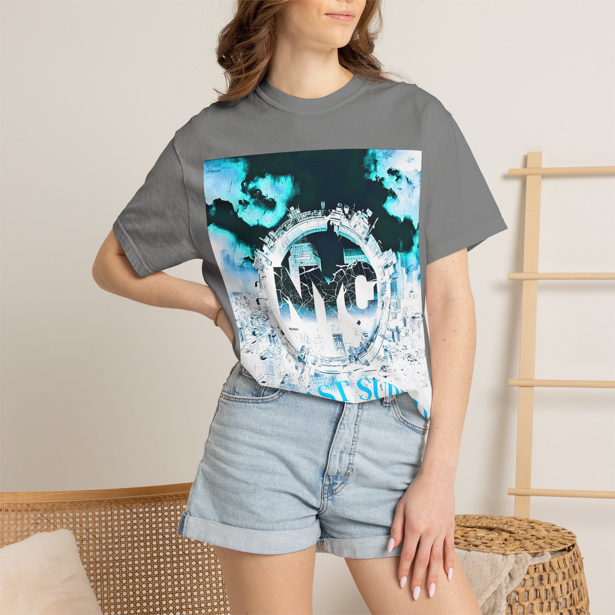 Gray graphic tee with NYC cityscape print, blue sky design, worn with denim shorts