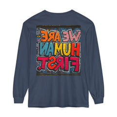 Blue long sleeve shirt with colorful graffiti text 'We Are Human First' on the back.