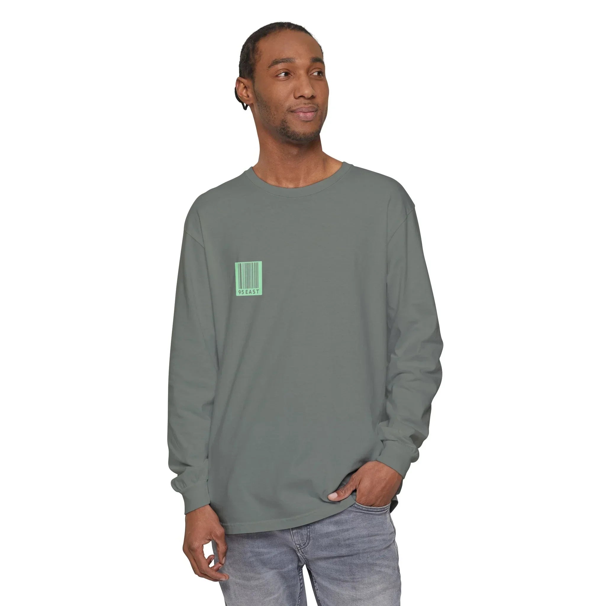 Man wearing olive long sleeve tee with barcode graphic, modern streetwear style