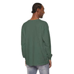 Man wearing olive green long-sleeve shirt and light jeans, back view