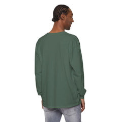 Man wearing olive green long-sleeve shirt and light jeans, back view