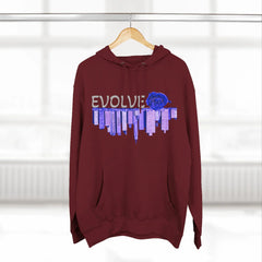 Maroon hoodie with EVOLVE text, blue rose, and city skyline graphic, hanging on hanger
