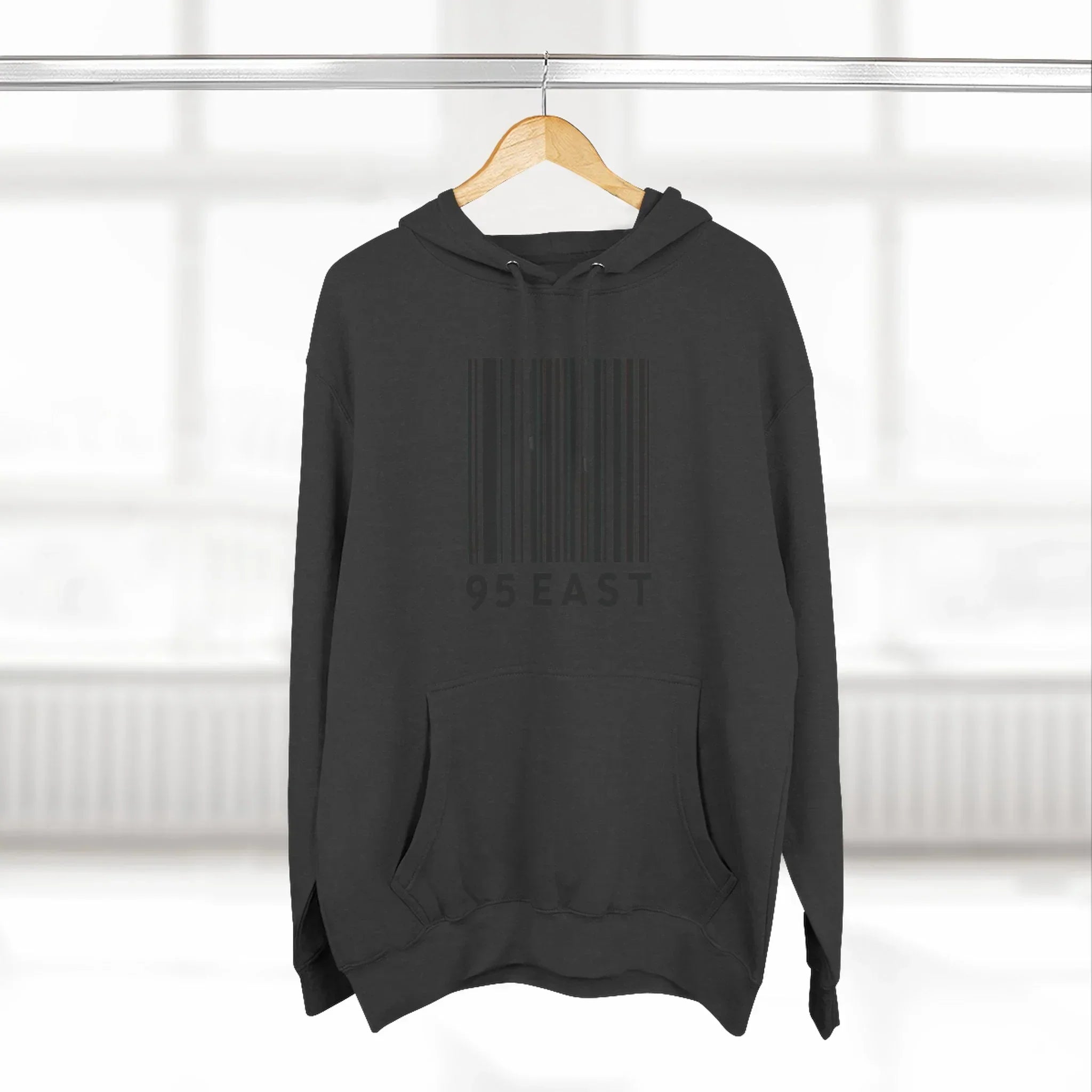 Black hoodie with barcode design and 95 EAST text, modern East Coast style