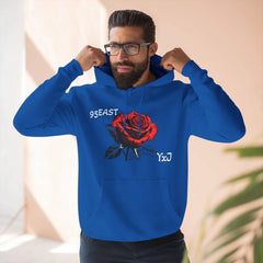 Blue hoodie with red rose graphic and '95EAST YxJ' text, worn by man adjusting hood