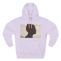 Lilac hoodie with graphic of man in orange beanie and beach background, word W.A.H. in red.
