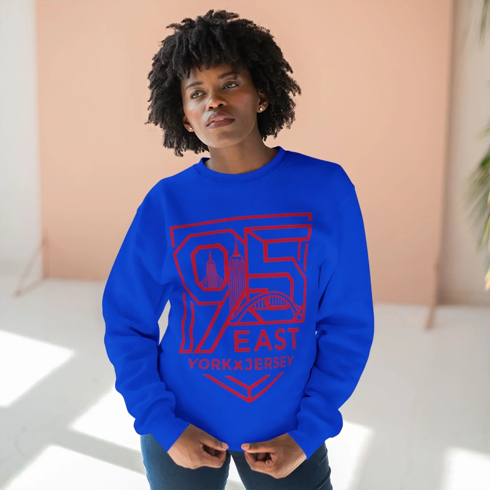 Blue sweatshirt with red 95 East YorkxJersey graphic, featuring city skyline design and modern streetwear style
