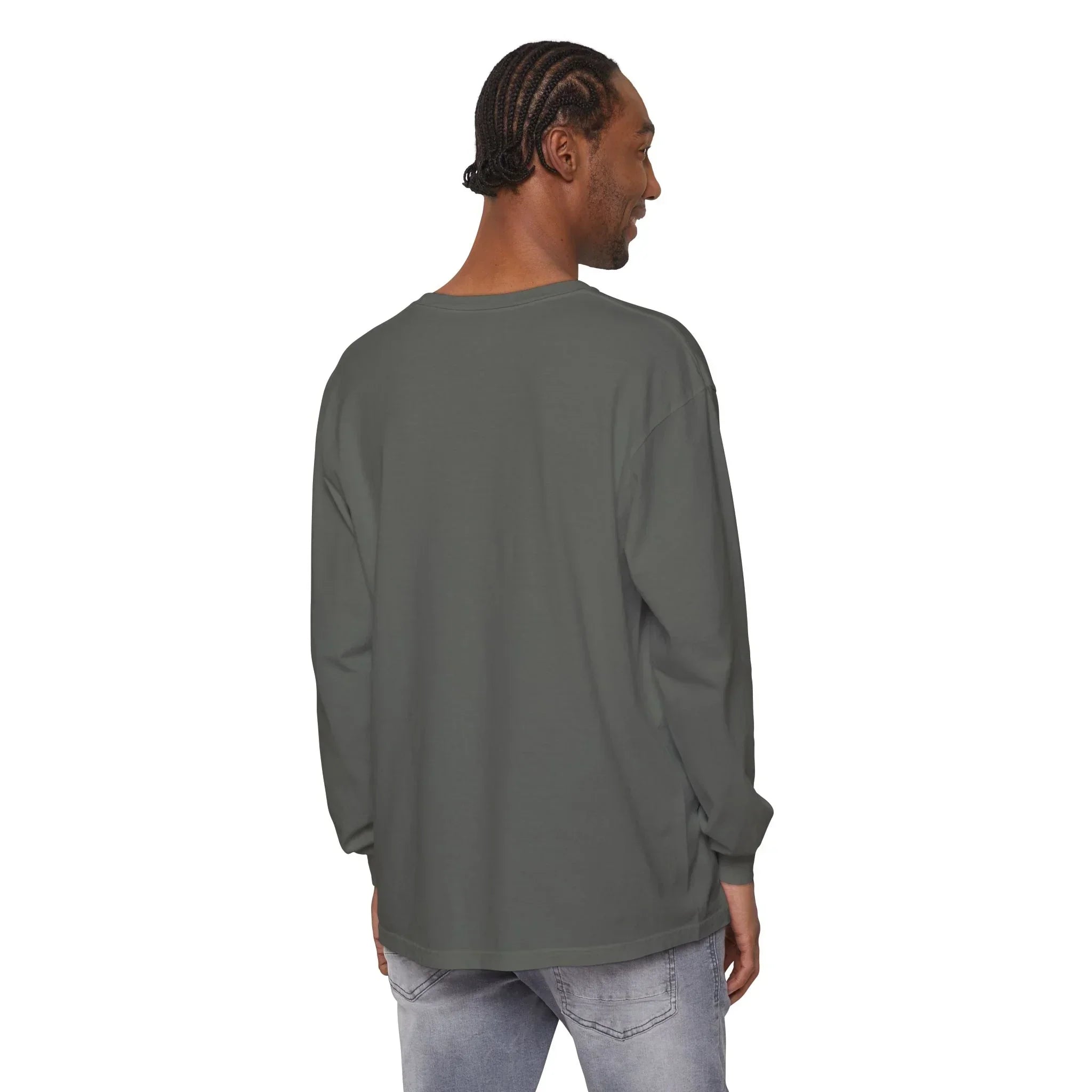 Man wearing olive green long sleeve tee, styled with light denim jeans, showcasing casual streetwear look