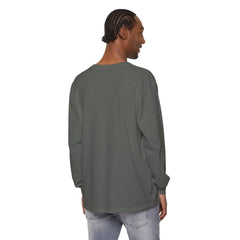 Man wearing olive green long sleeve tee, styled with light denim jeans, showcasing casual streetwear look
