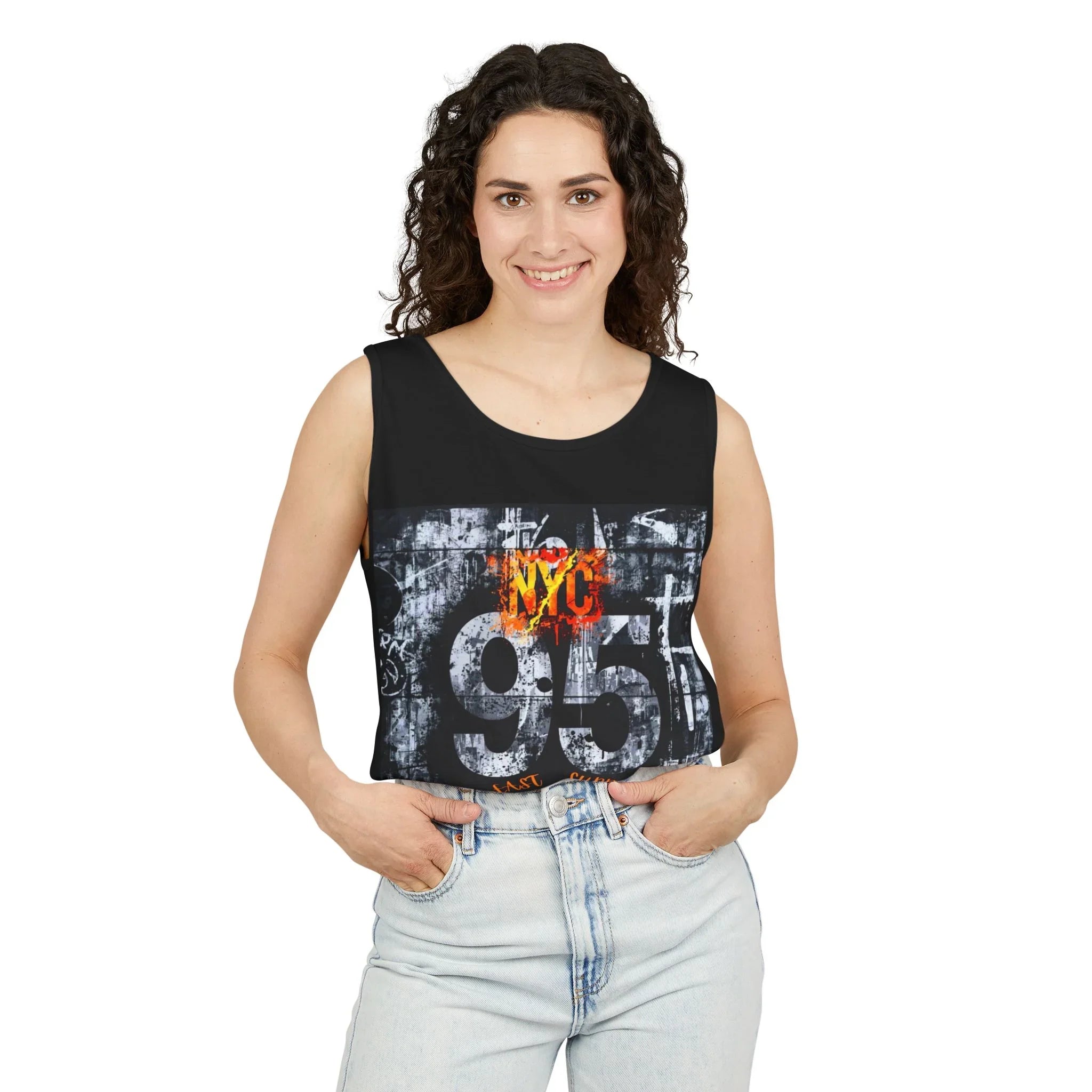 Woman wearing black NYC 95 graphic tank top with distressed urban print, paired with light denim jeans.