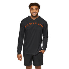 Man wearing black hoodie with orange 95EAST SUPPLY text, paired with matching shorts, showcasing casual streetwear style.