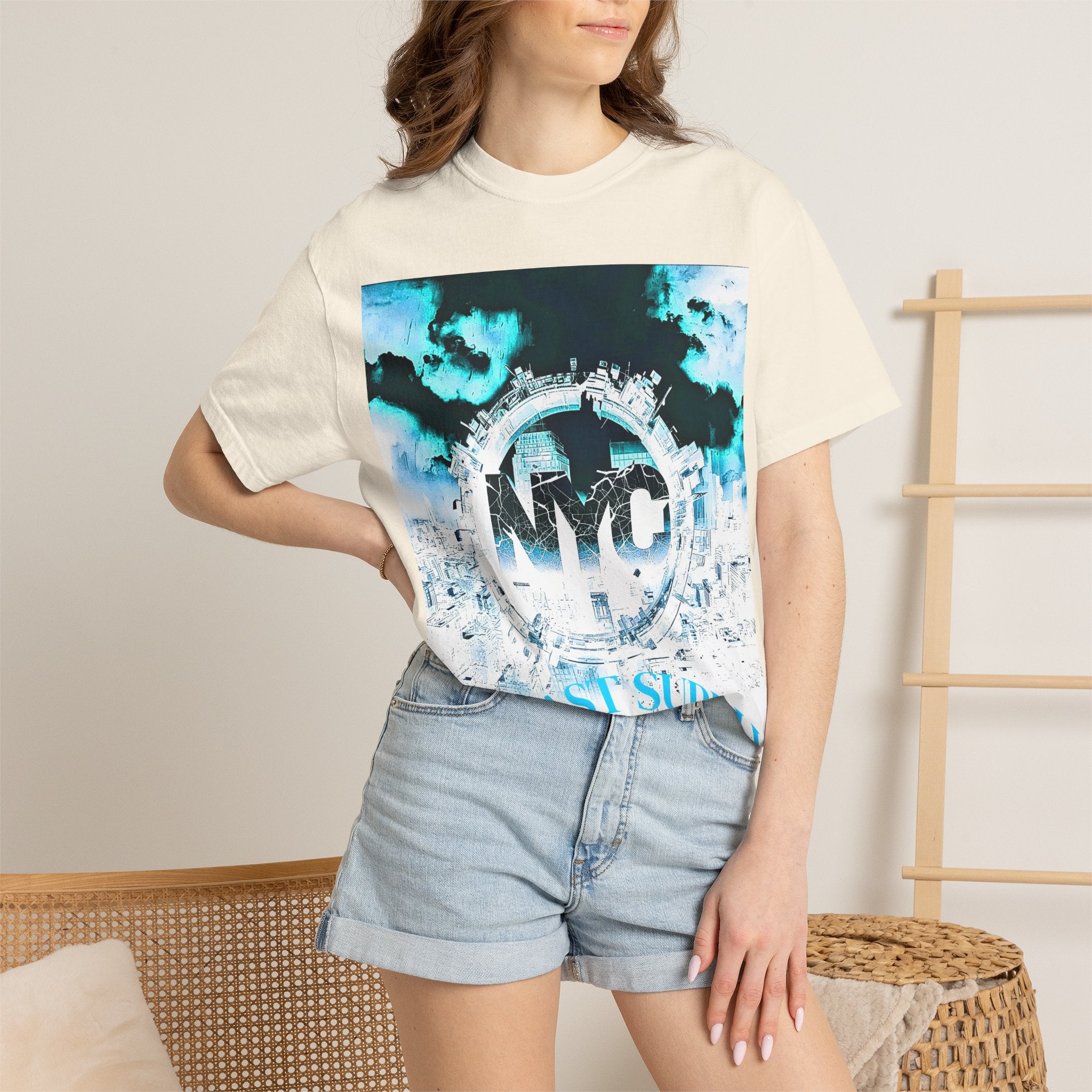 Cream NYC graphic tee with blue city skyline print, paired with denim shorts for casual streetwear style