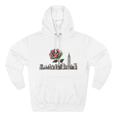White hoodie with pink rose and city skyline graphic, urban streetwear style