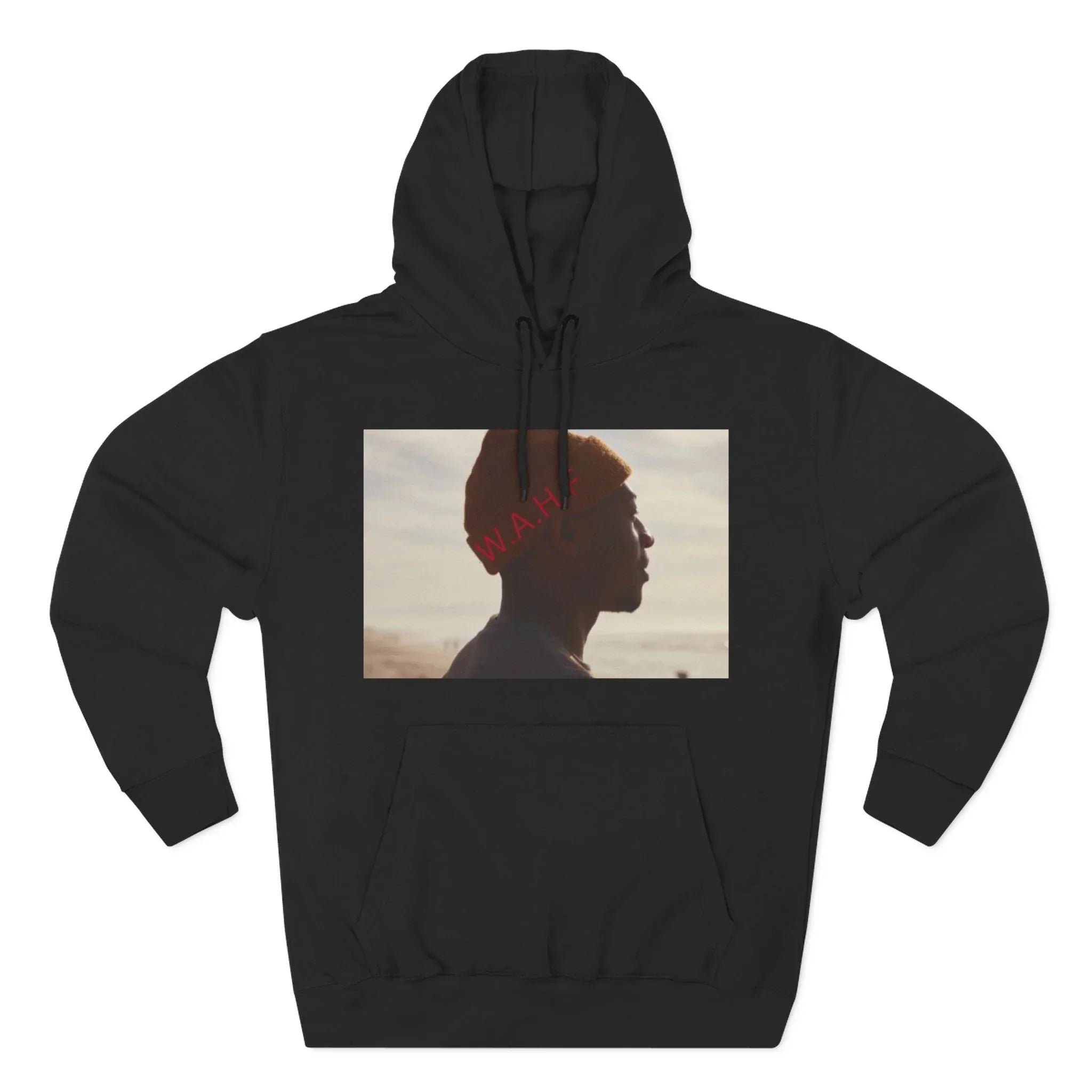 Black hoodie with a photo print of a person in profile view wearing an orange beanie