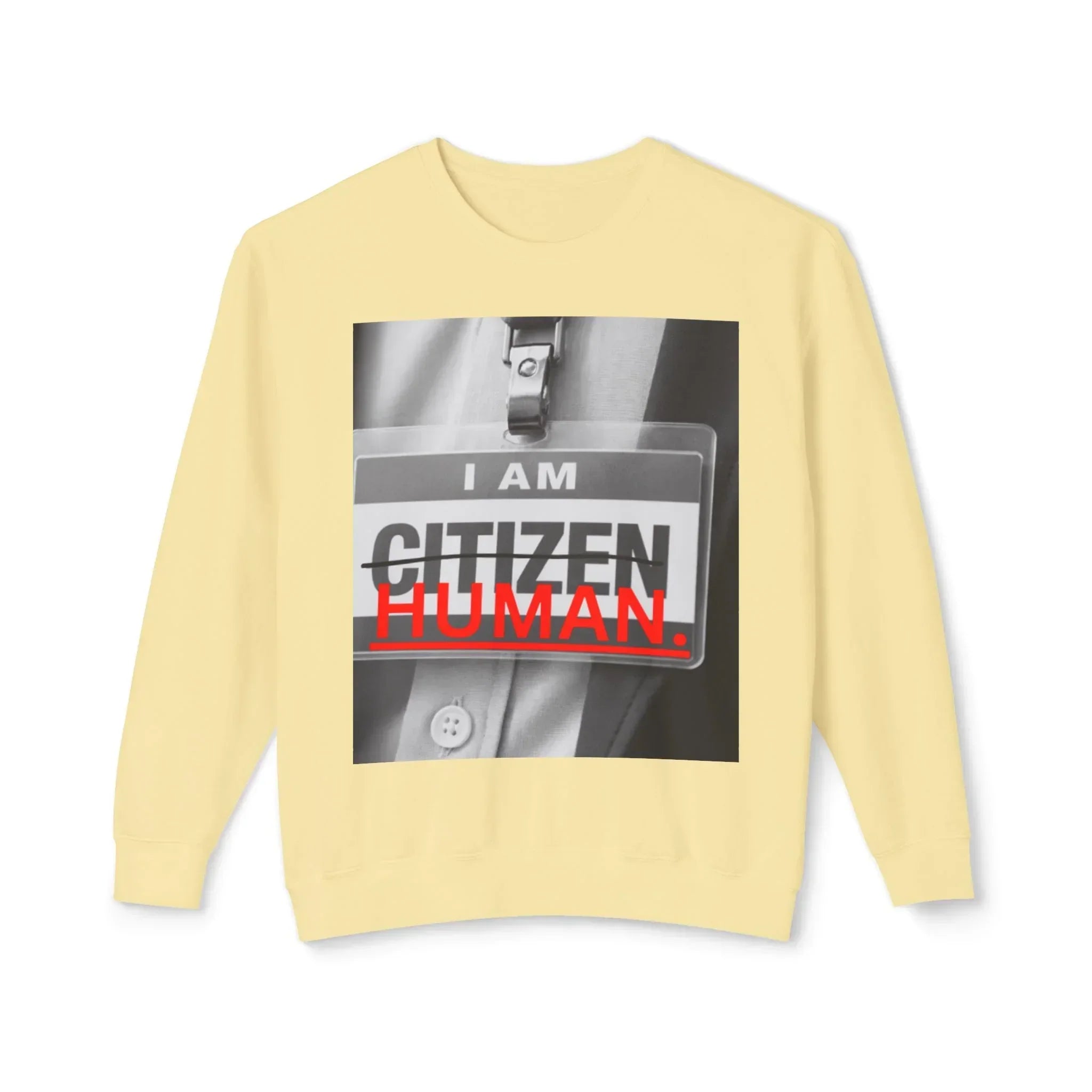 Beige sweatshirt with graphic "I AM HUMAN" bold text over a name tag print on the front.