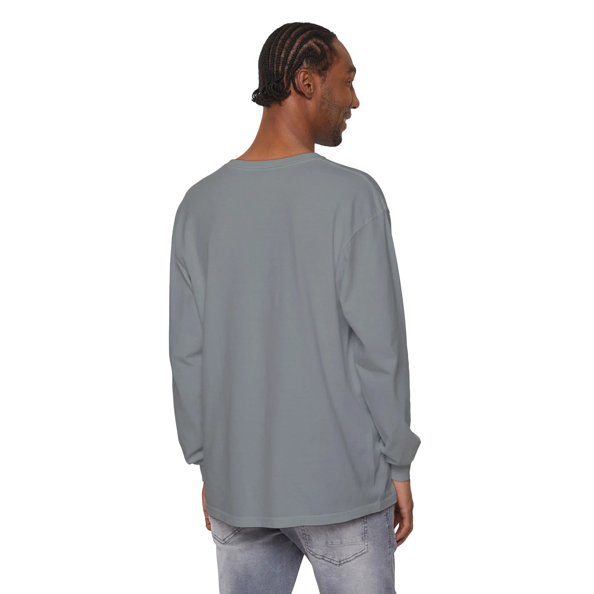Man wearing gray long sleeve t-shirt with relaxed fit, styled with light wash jeans for casual everyday wear