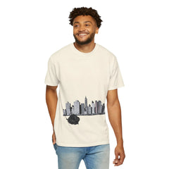 Man wearing cream t-shirt with city skyline and black rose graphic, modern urban streetwear style