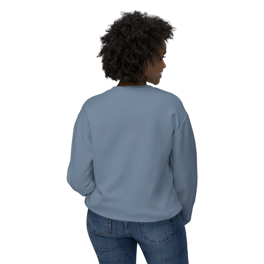 Woman in blue crewneck sweatshirt and jeans, back view, on white background
