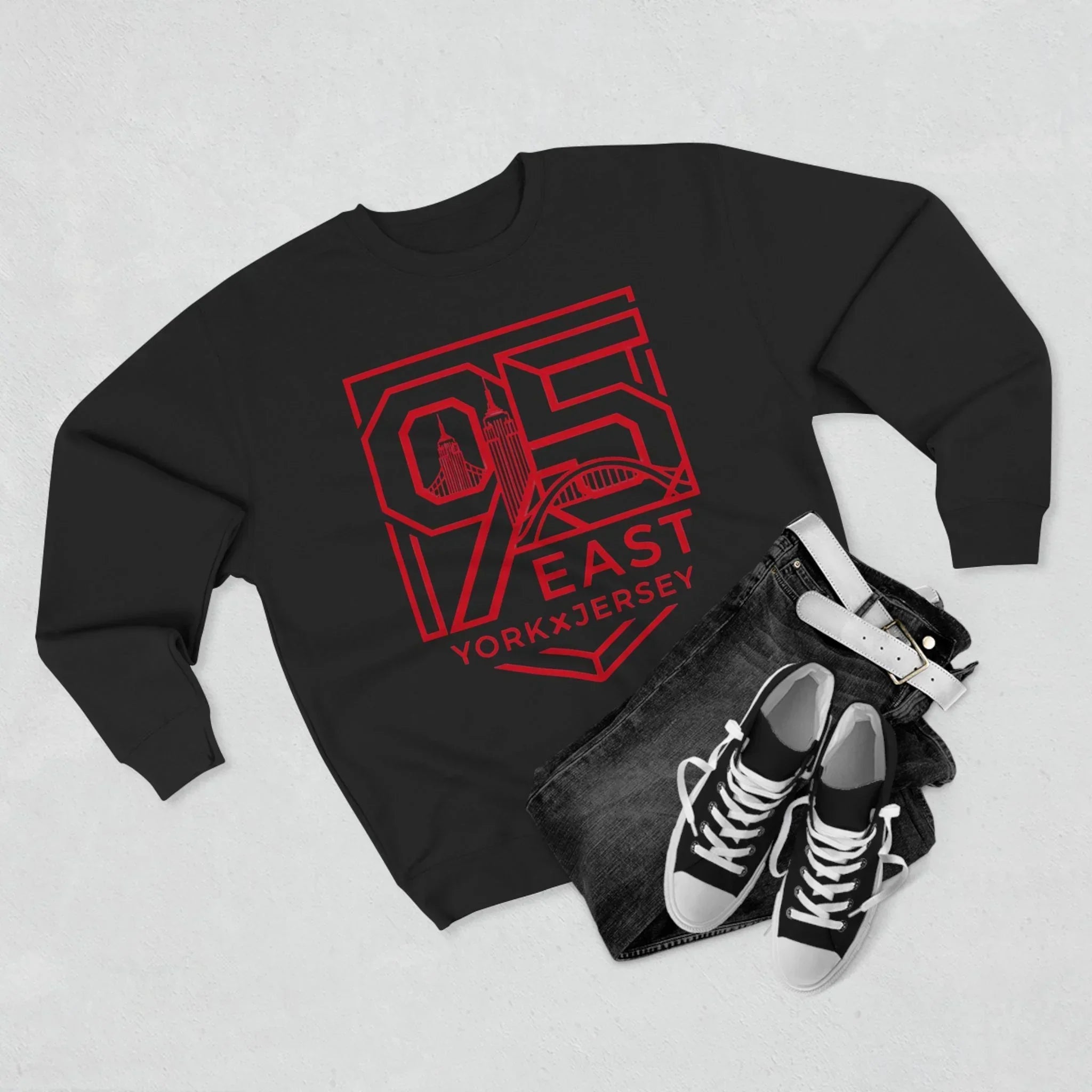 Black hoodie with red 95 East YorkxJersey graphic, paired with jeans and sneakers for urban streetwear style