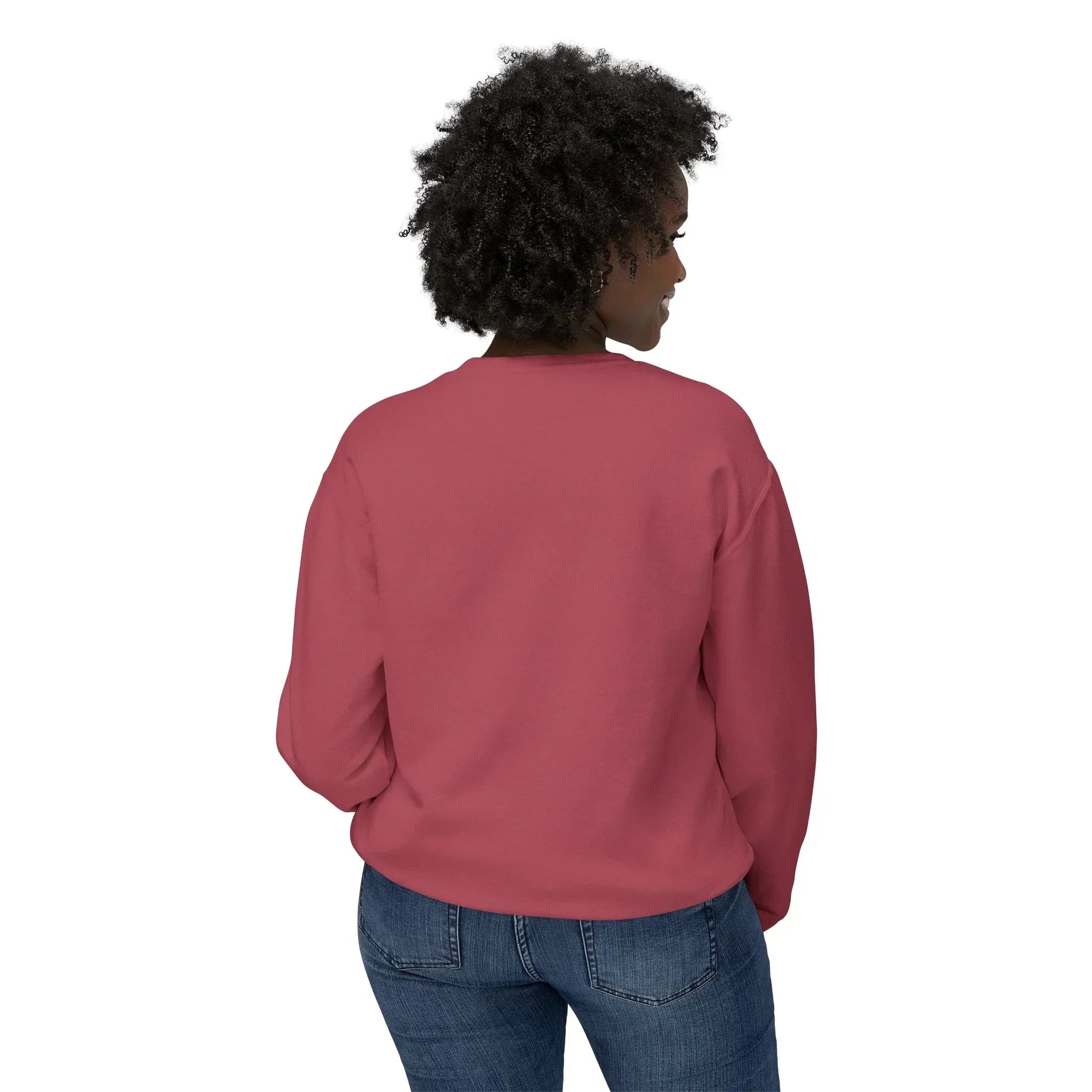Woman wearing a rose pink crewneck sweatshirt and blue jeans, shown from the back