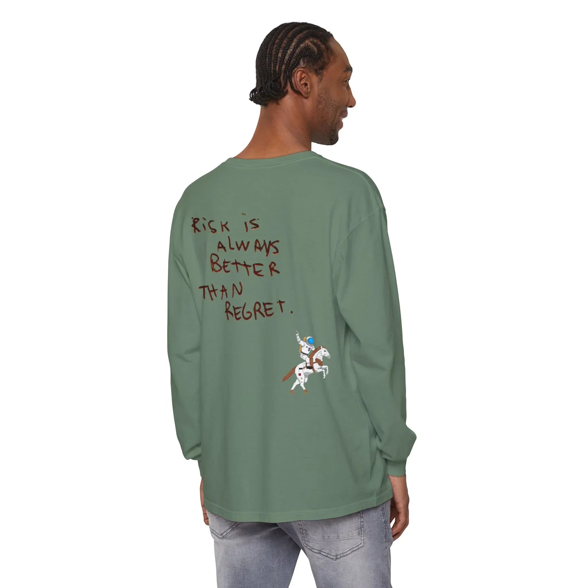 Green long sleeve shirt with 'Risk is Always Better Than Regret' text and astronaut on horse graphic