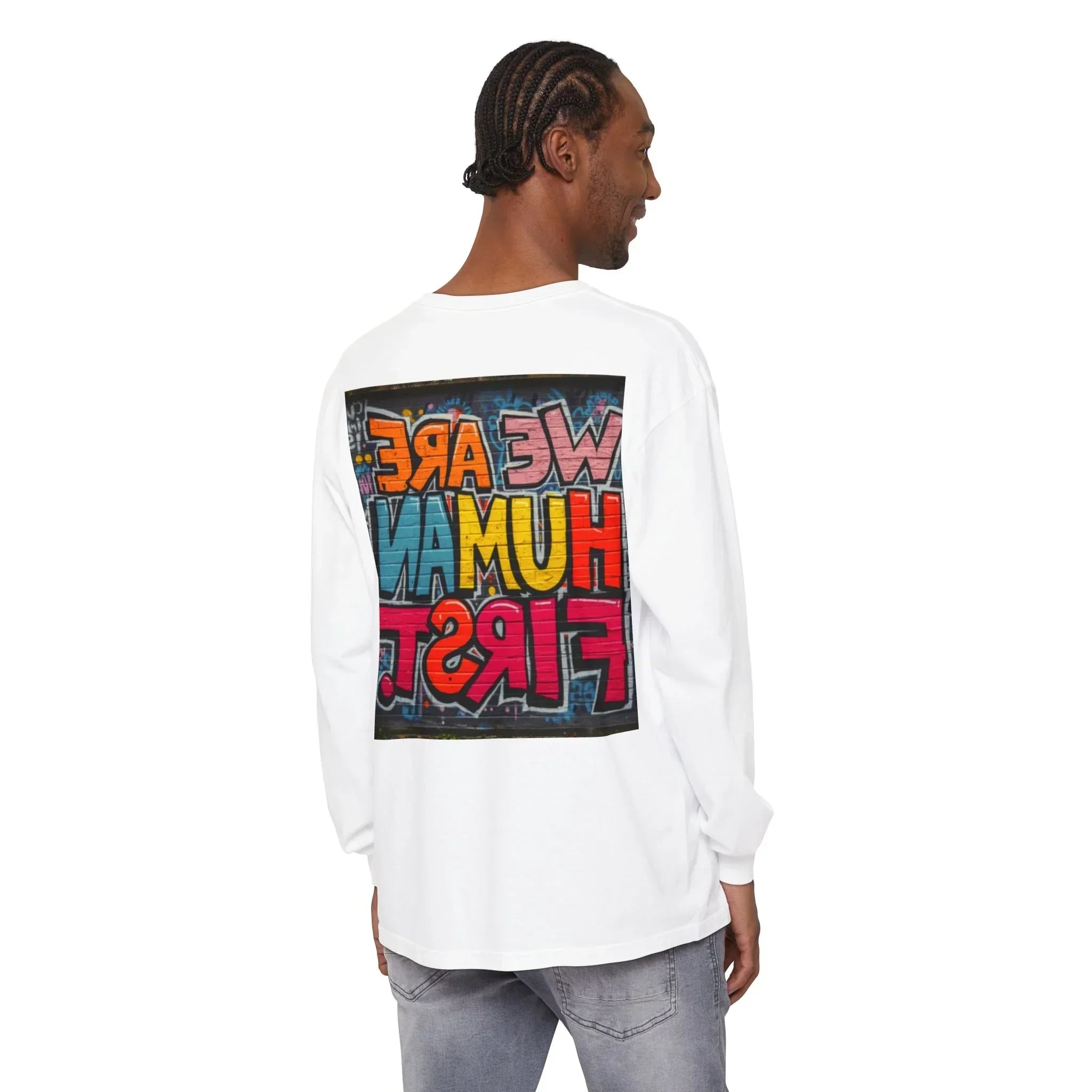 Man wearing a white long sleeve shirt with colorful graffiti text on the back, casual style