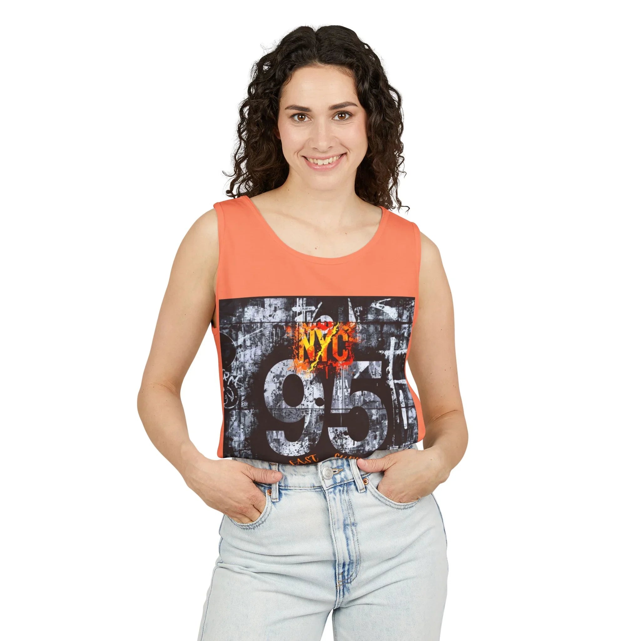 Woman wearing orange sleeveless top with NYC 95 graphic, paired with light denim jeans