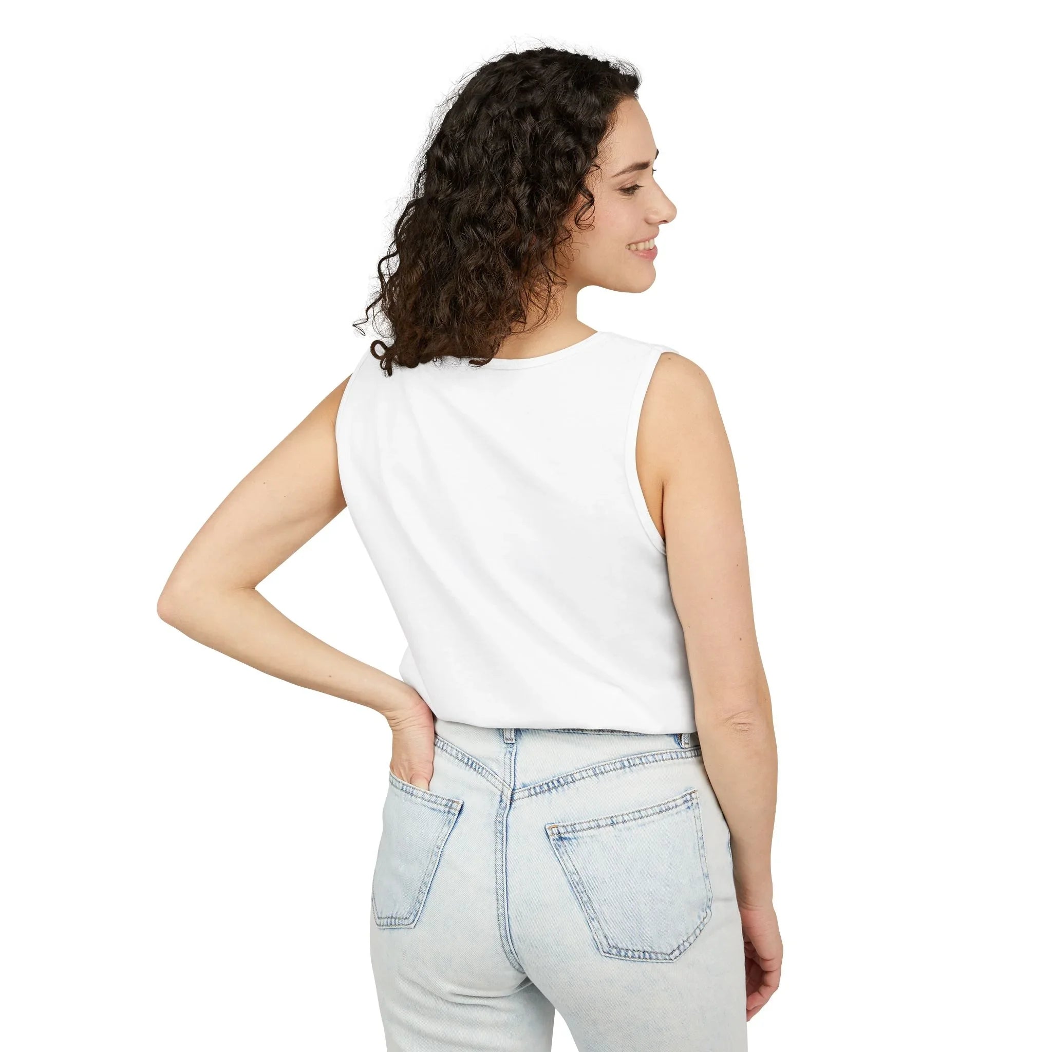 Woman in white sleeveless top and light wash jeans, back view, casual everyday style
