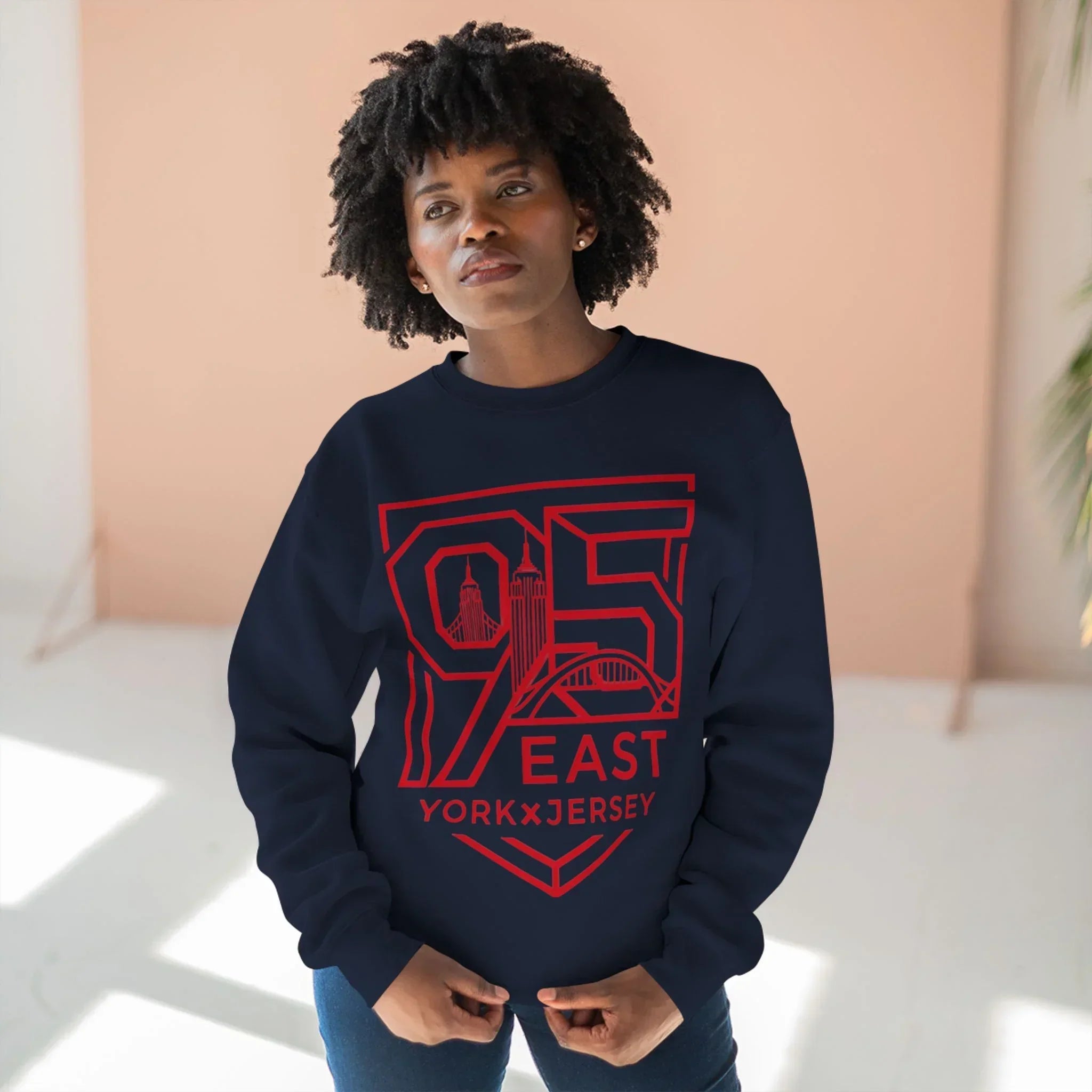Black hoodie with red 95 East YorkxJersey graphic, featuring skyline design and barcode sleeve detail