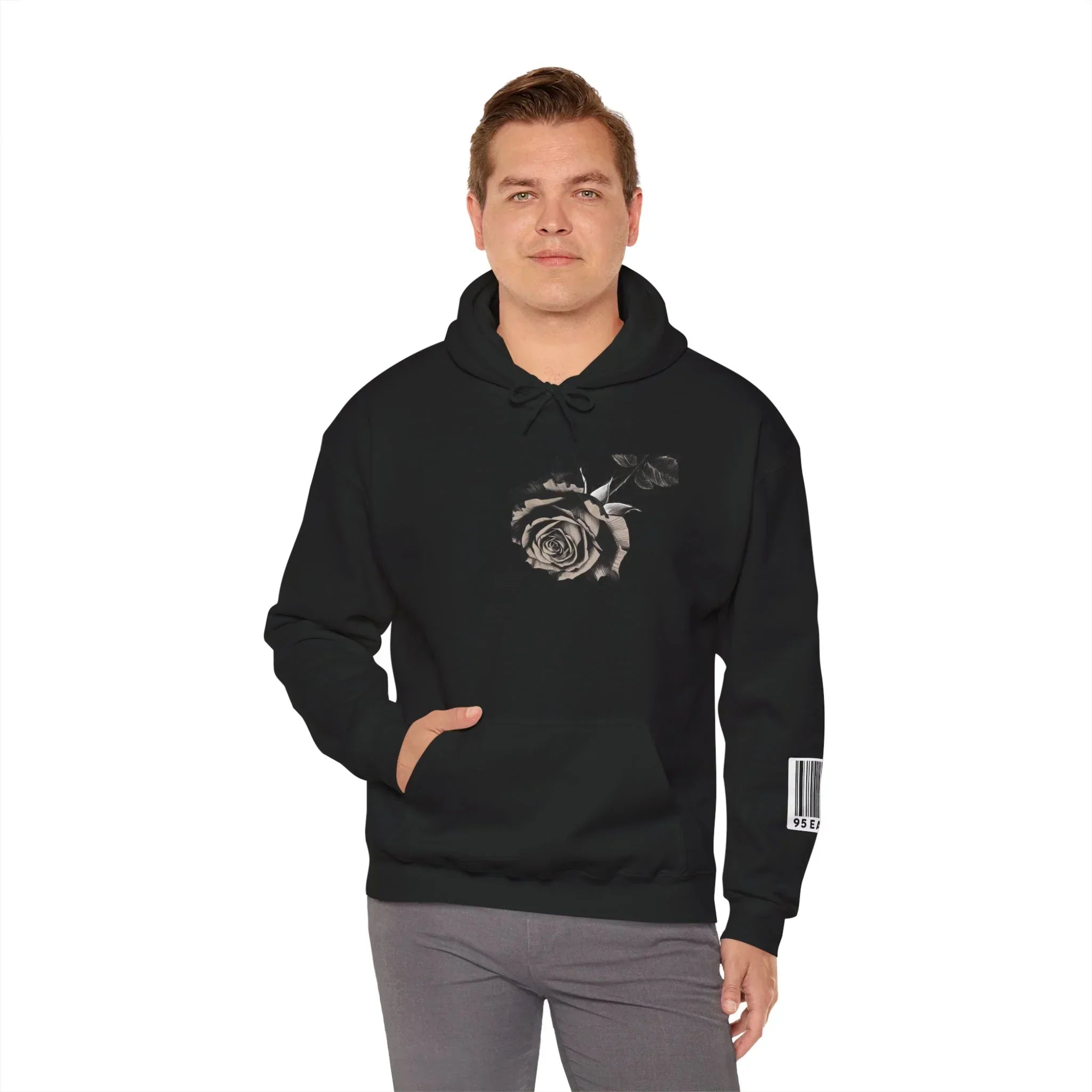Man wearing black hoodie with grayscale rose graphic and barcode on the sleeve