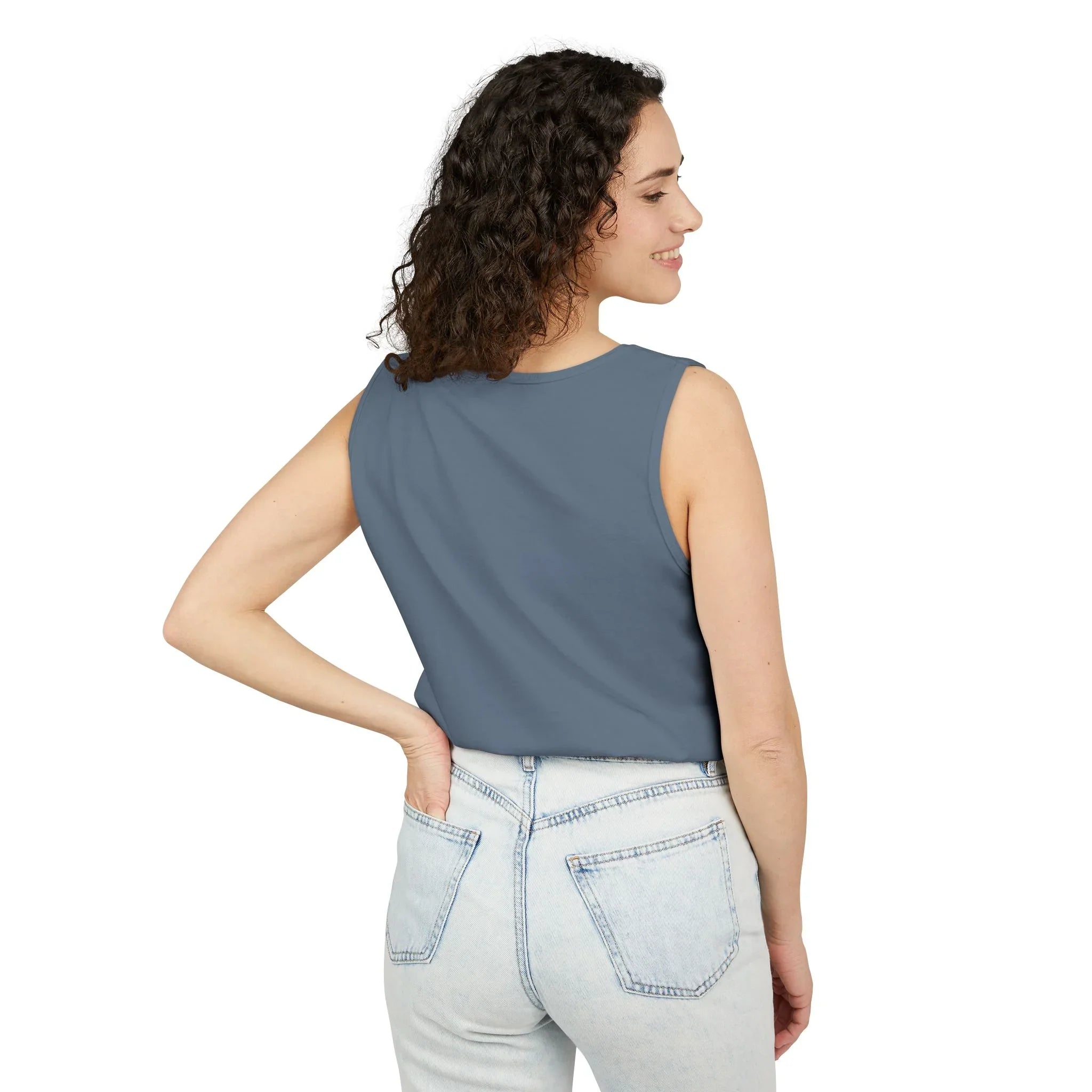 Woman wearing blue sleeveless top and light wash jeans, back view