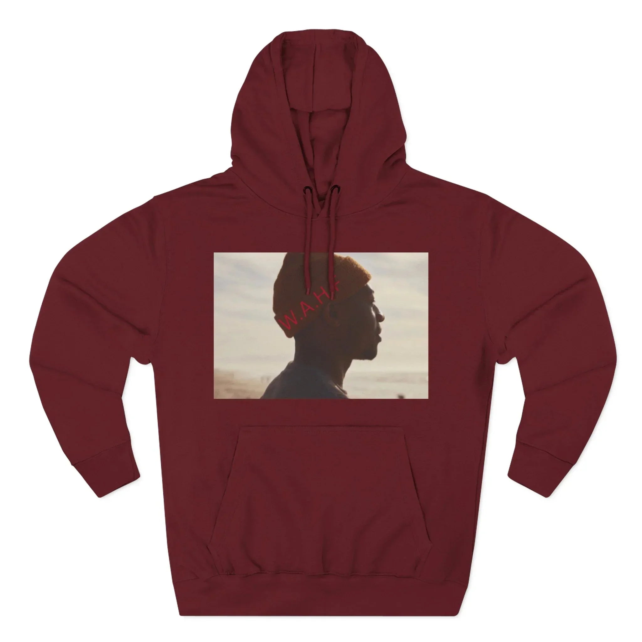 Maroon hoodie with graphic of person in beanie, outdoor background, text W.A.H.F.