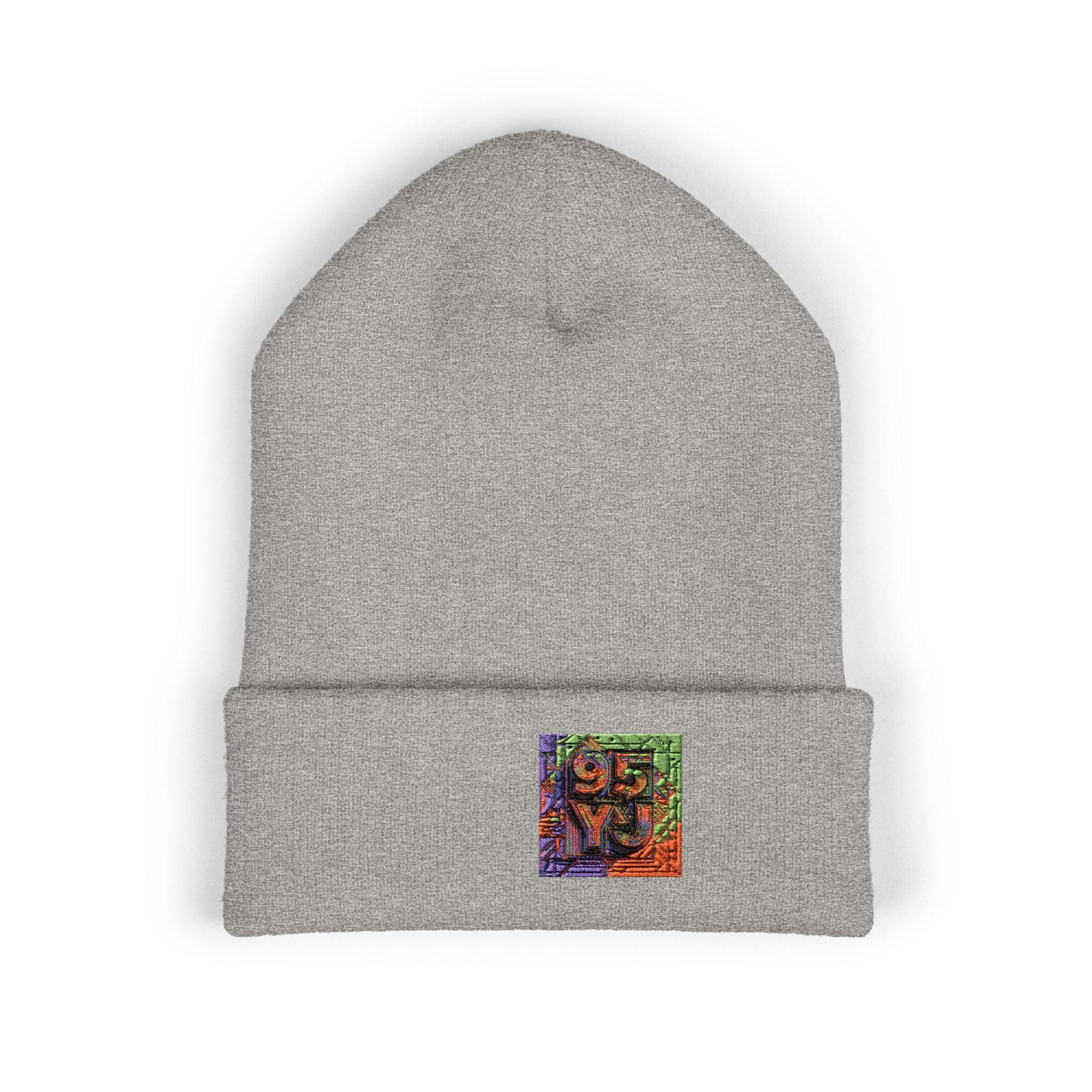 Light gray beanie with colorful embroidered patch featuring geometric design and numbers.