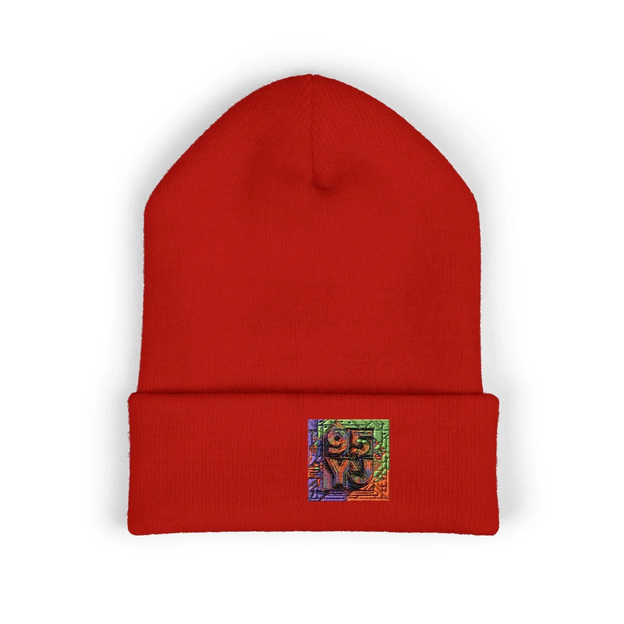 Red knit beanie with colorful embroidered patch on cuff, modern streetwear accessory