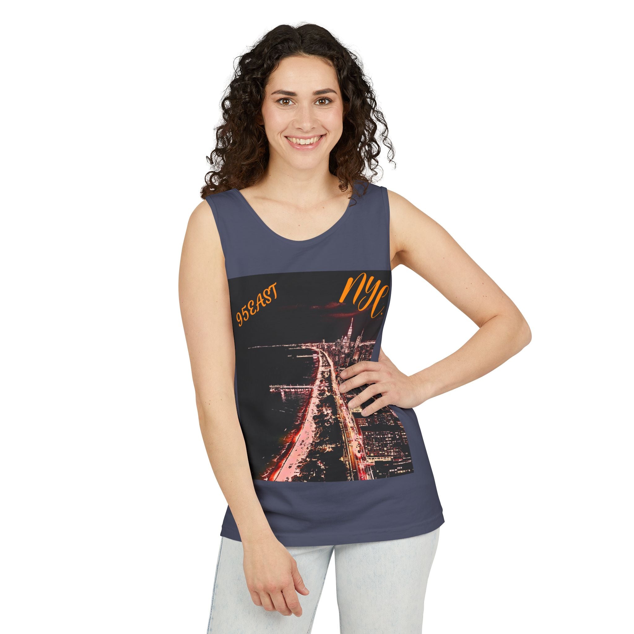 Woman wearing sleeveless navy tank top with NYC night cityscape print and 95EAST text