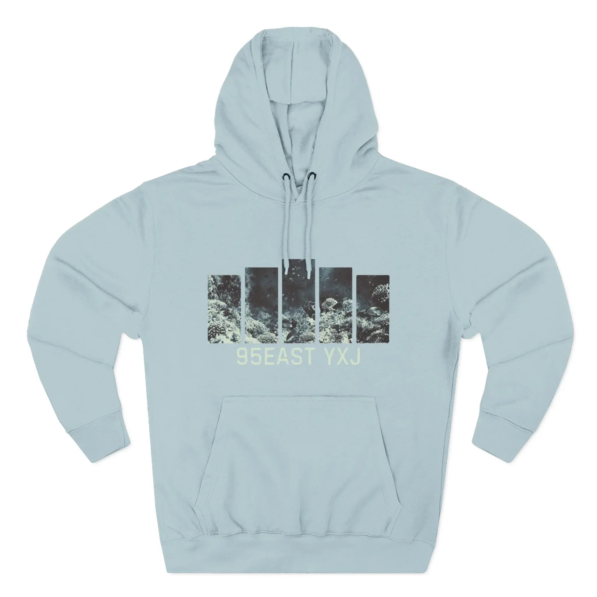 Light blue hoodie with abstract black and white bar graphic and text 95EAST YXJ on front.