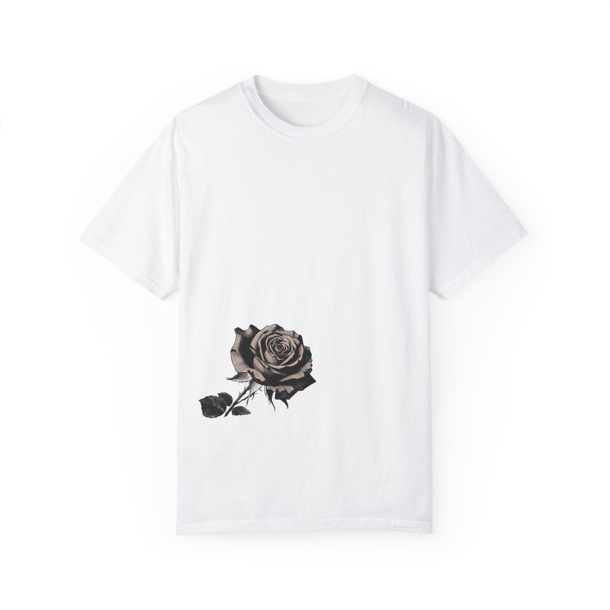White t-shirt with a black and grey rose graphic on the lower front