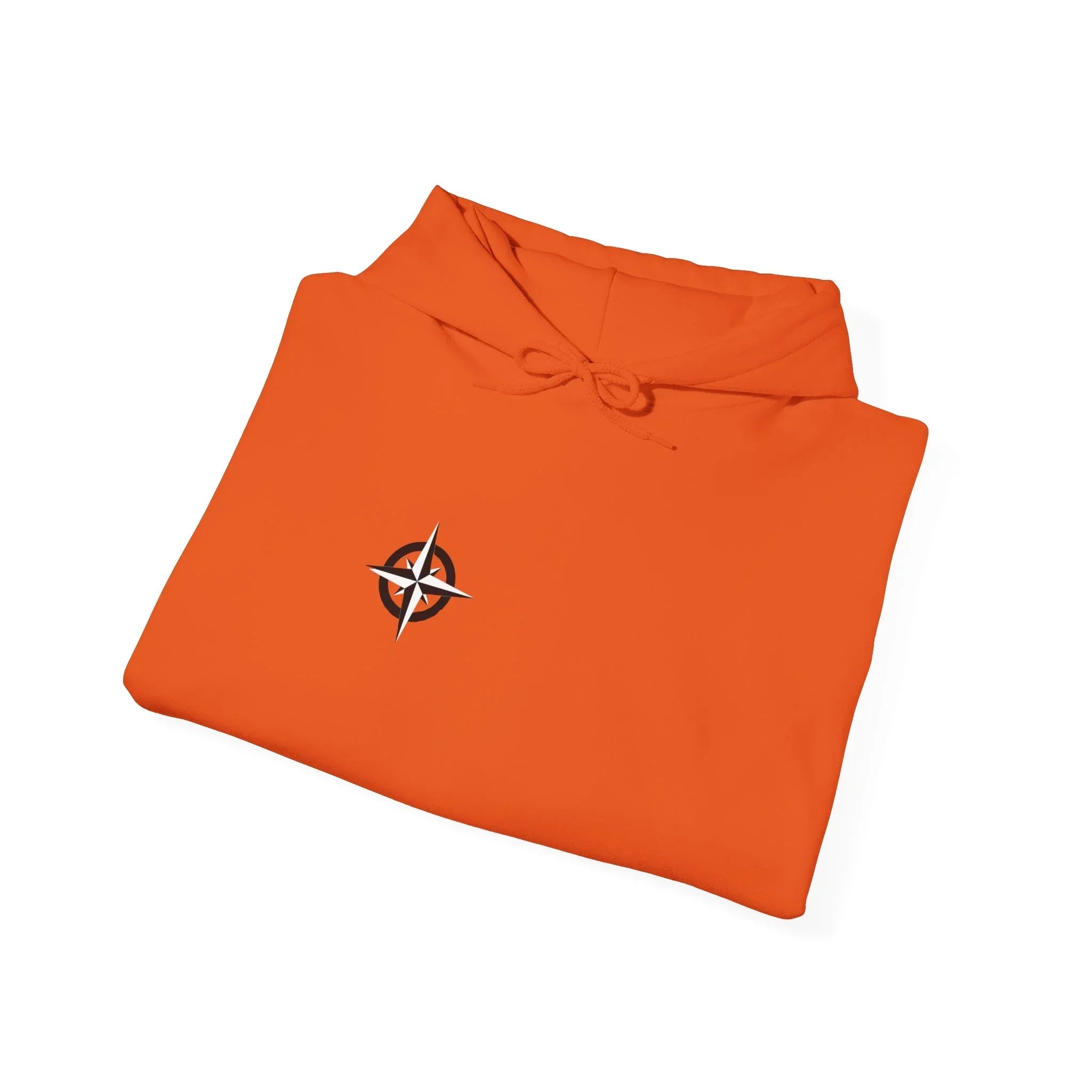 Folded orange hoodie with compass rose graphic on chest, minimalist streetwear style