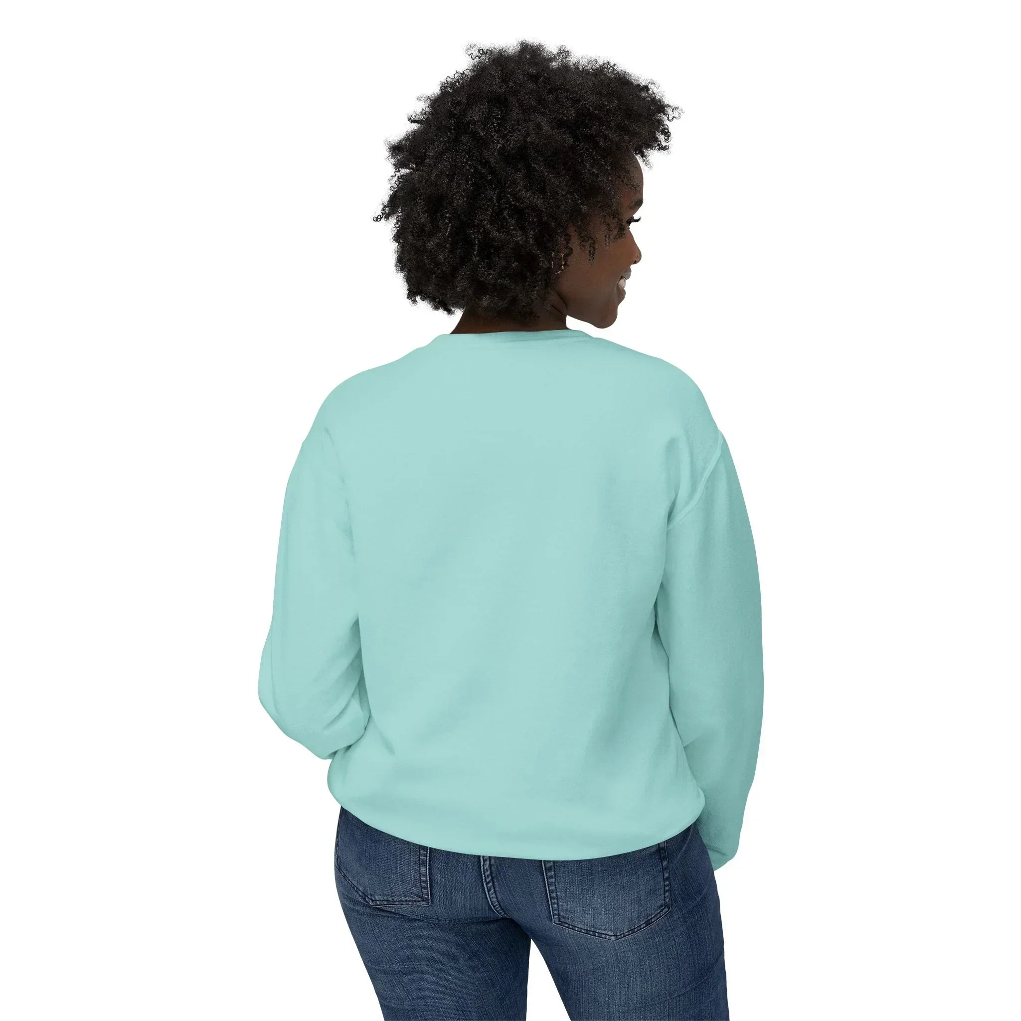 Woman wearing light blue crewneck sweatshirt and jeans, back view, on white background