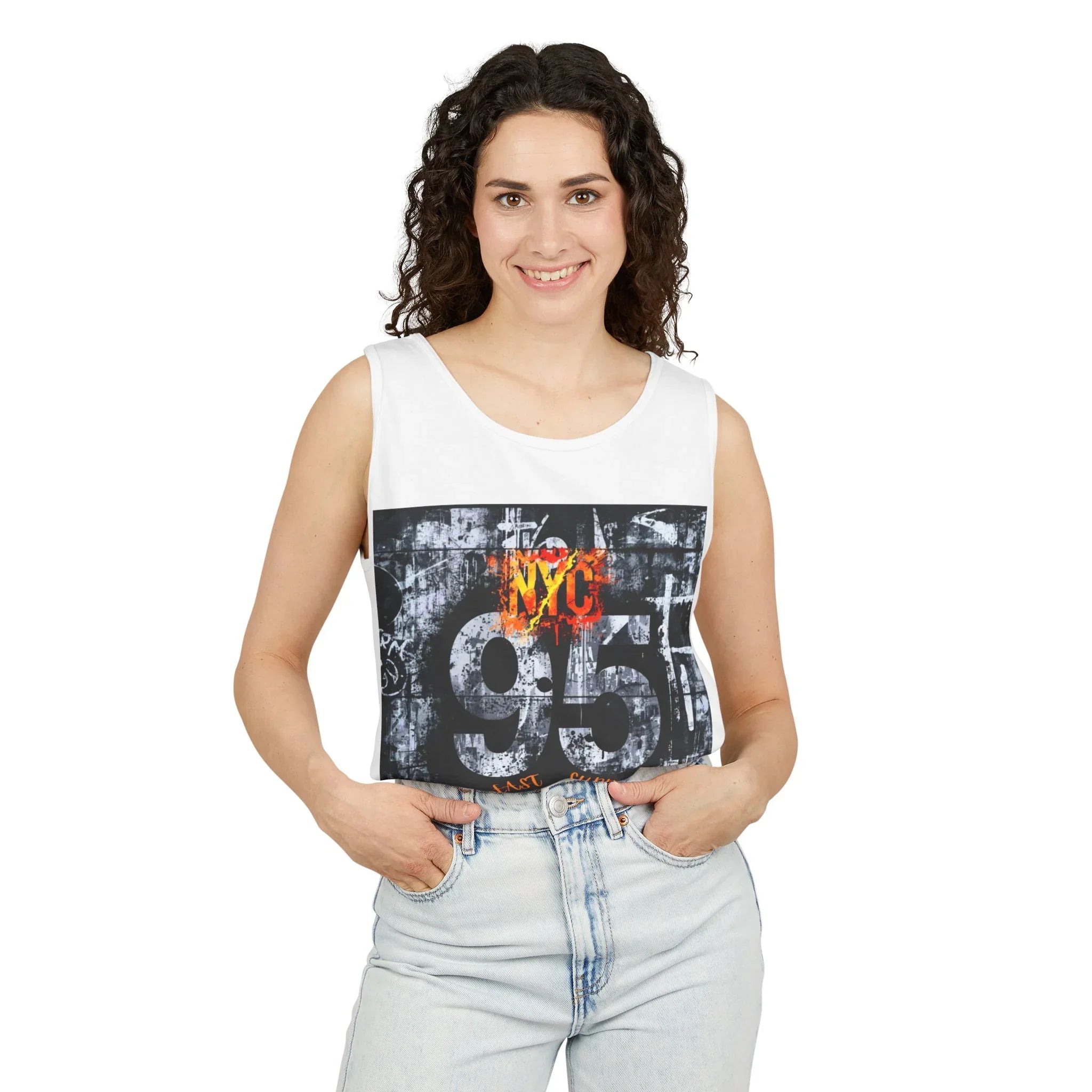 Woman wearing white graphic tank top with NYC 95 design, paired with light denim jeans