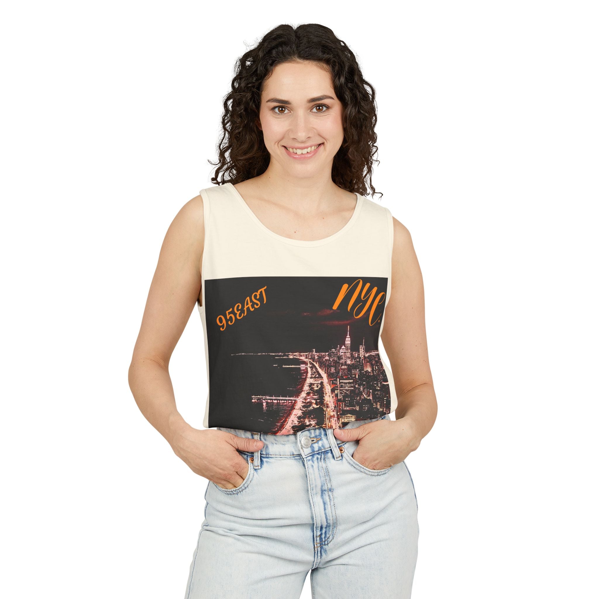 Woman wearing sleeveless top with NYC skyline graphic and '95EAST NYC' text, casual style