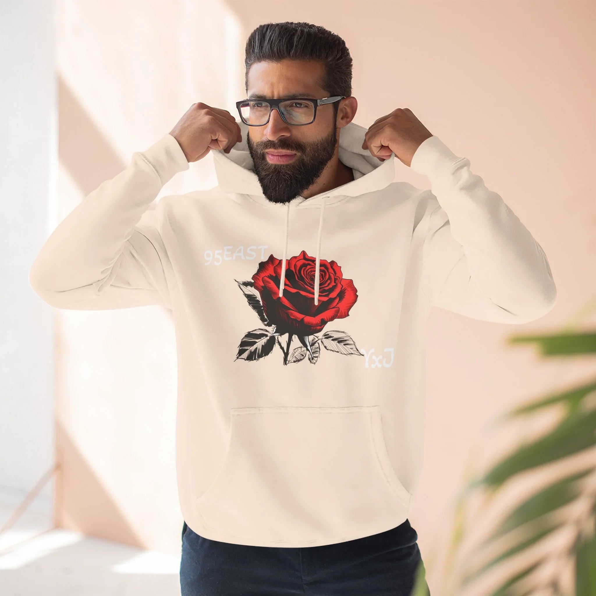 Black hoodie with rose graphic and barcode sleeve detail