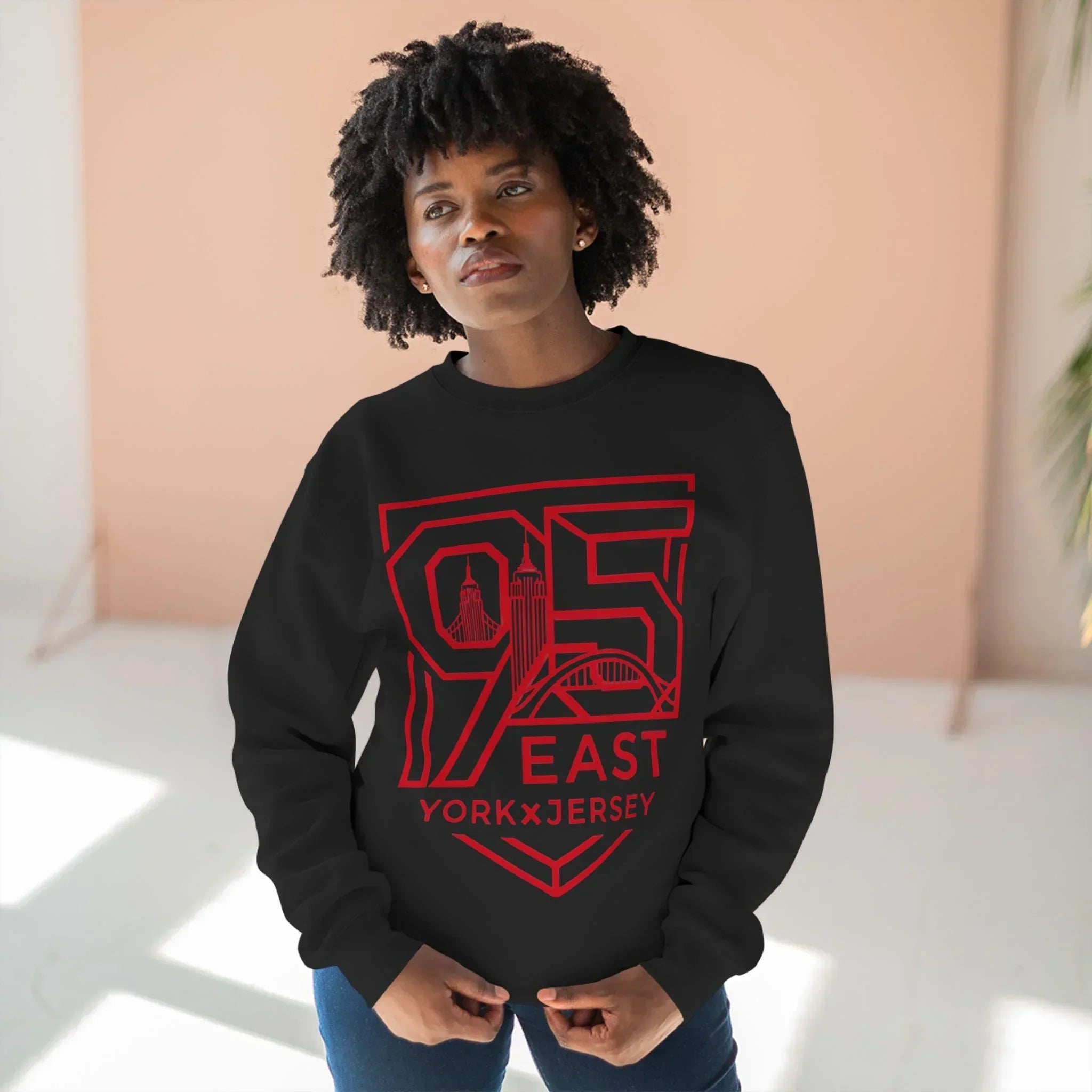 Black hoodie with red 95 East York x Jersey graphic, featuring city skyline design and barcode sleeve detail