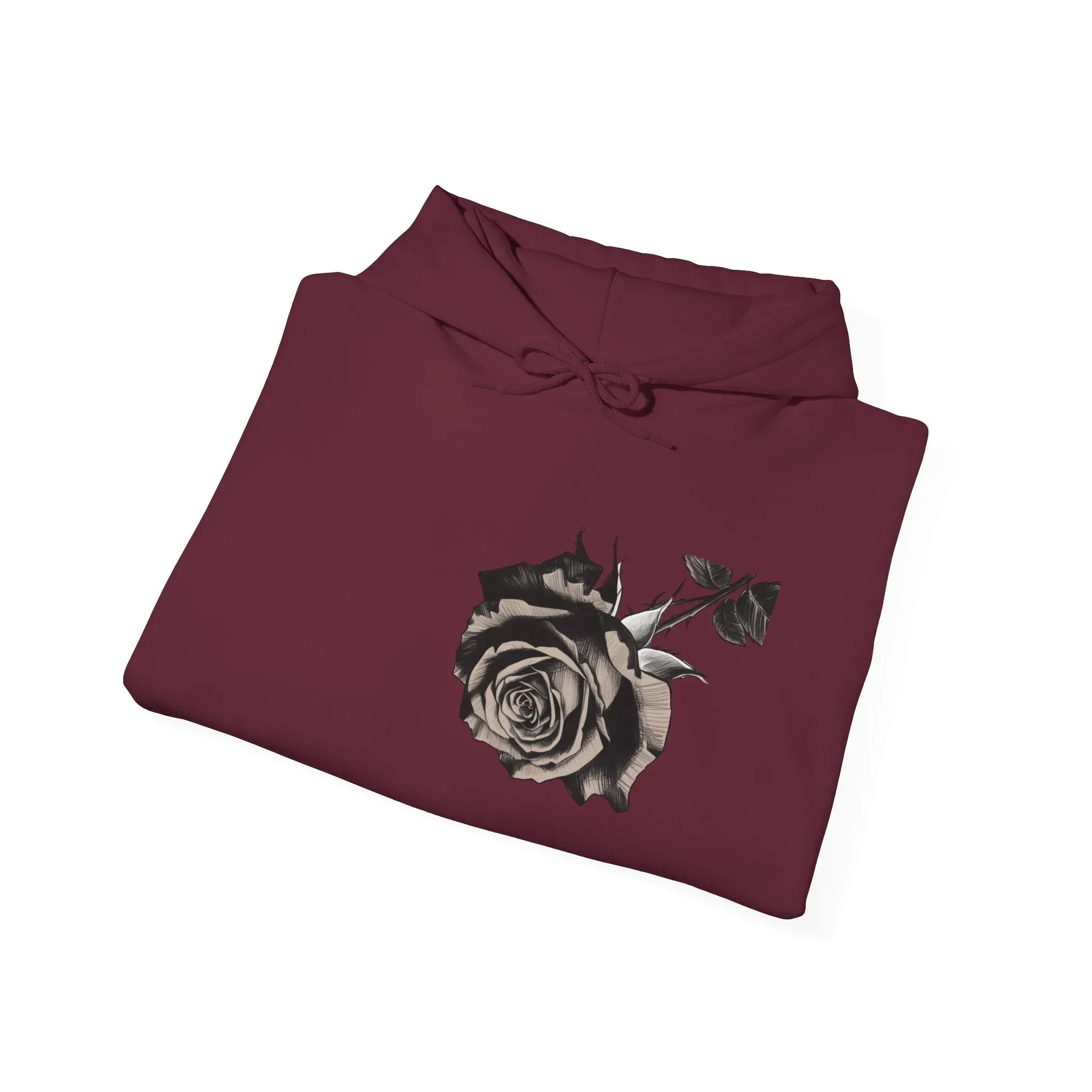 Folded maroon hoodie with black and white rose graphic on front