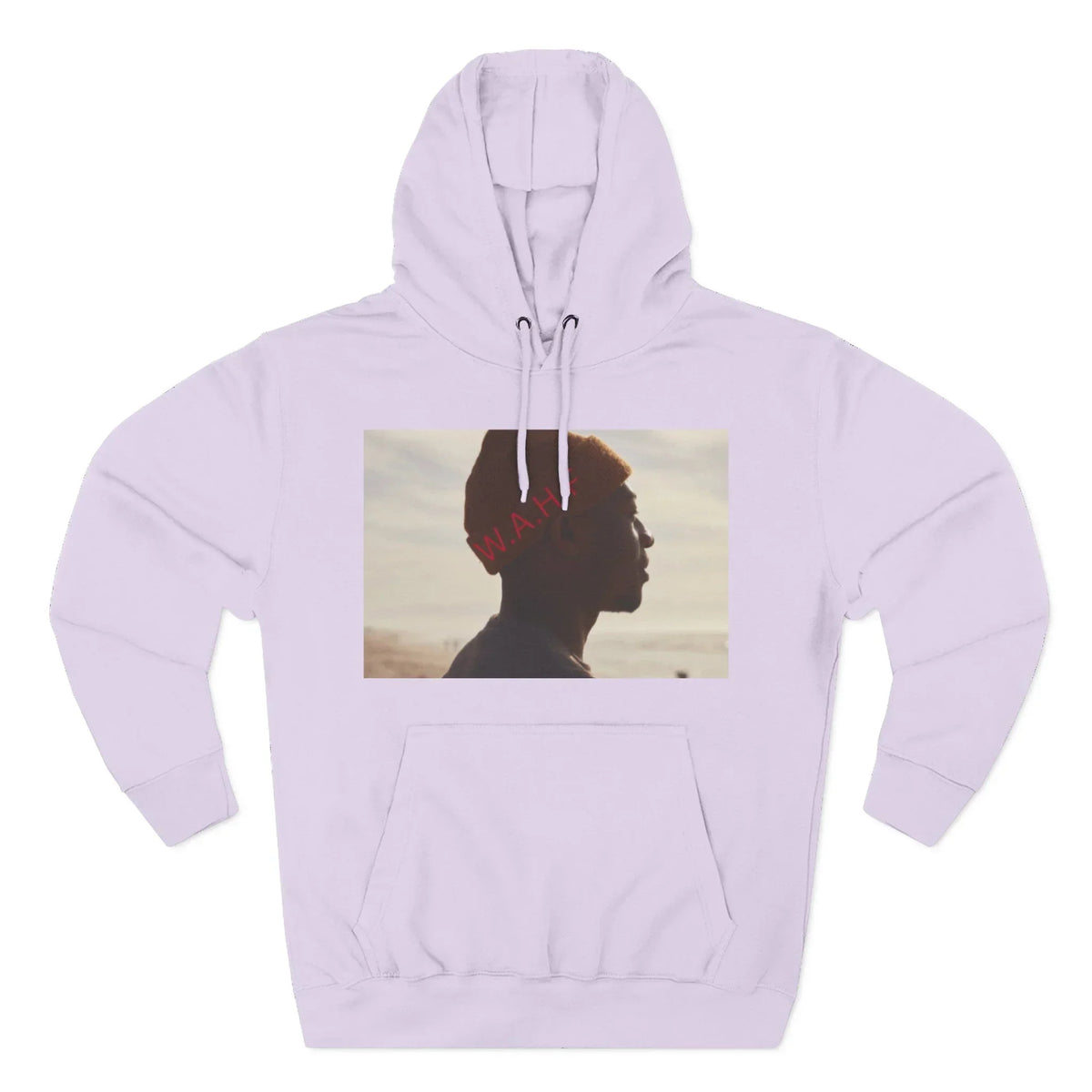 Lilac hoodie with graphic of man in orange beanie and beach background, word W.A.H. in red.