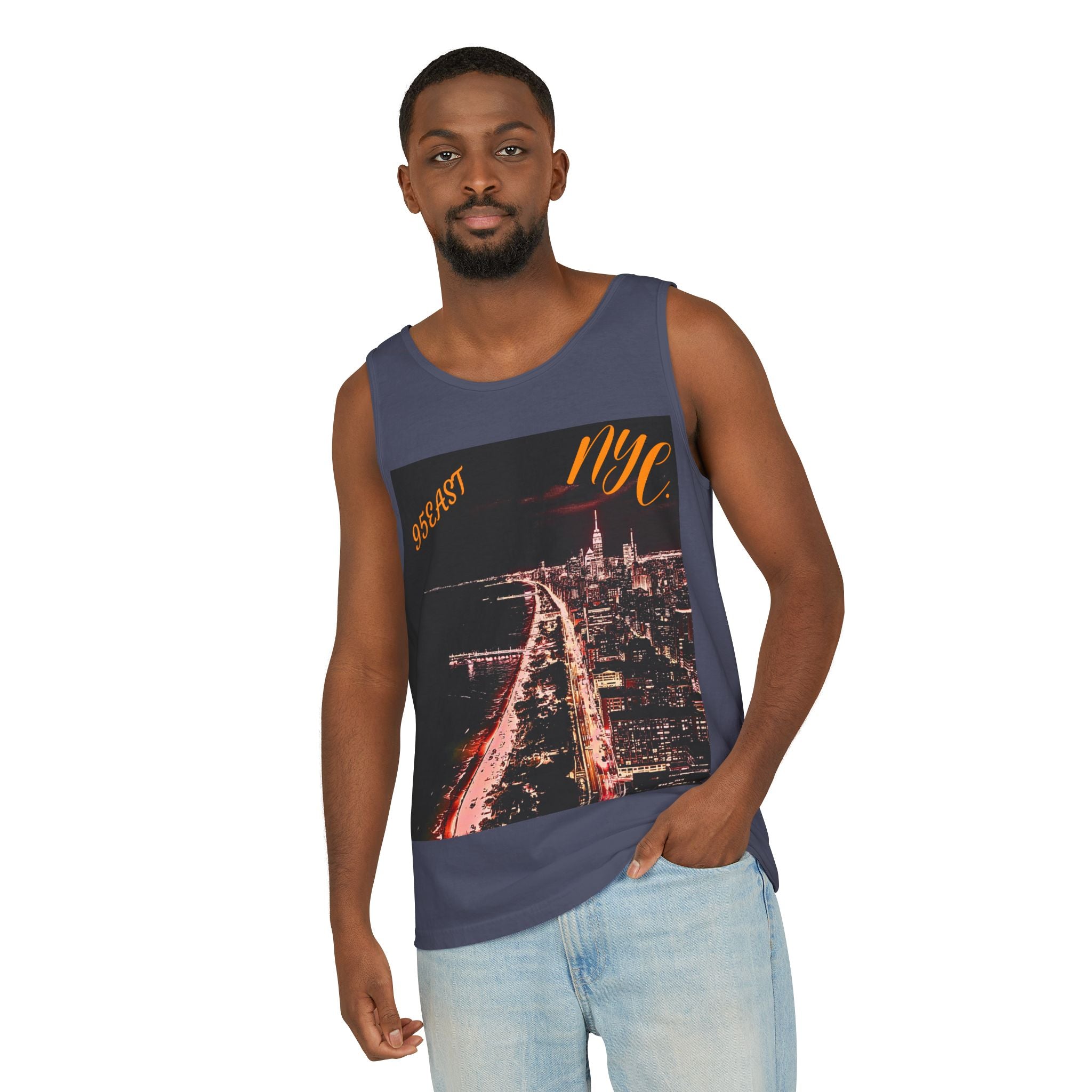 Man wearing navy tank top with NYC skyline graphic and casual light jeans