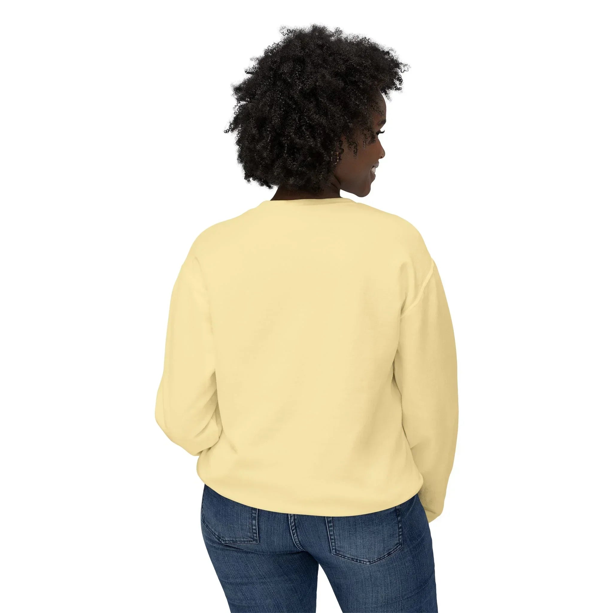 Woman in light yellow sweatshirt and blue jeans, back view on white background