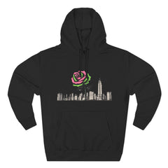 Black hoodie with pink rose graphic over city skyline, barcode detail on sleeve